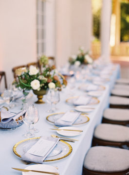 Place settings at an outdoor wedding reception