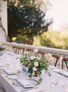 Place settings at an outdoor wedding reception