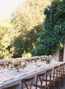 Place settings at an outdoor wedding reception