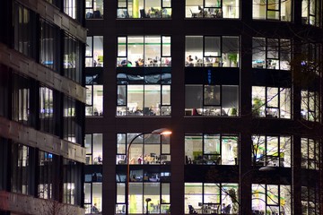 Modern office building at night. Night lights, city office building downtown, cityscape view