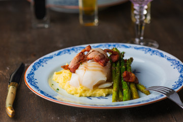cod on plate with sparris and bacon