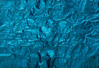 Blue crumpled foil background