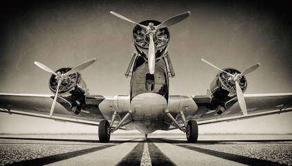 retro style of an historical aircraft on a runway