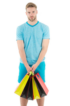 Man handsome unshaved macho hold bunch shopping bags. Buy gifts concept. Guy shopping before holidays. Shopping discount sale season. Man carry paper bags with items. Shopping confusing him