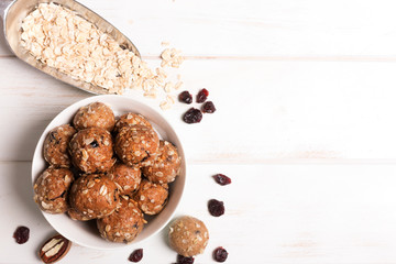Healthy organic energy granola bolls with nuts, cacao, oats and raisins - vegetarian sweet bites without sugar © zakiroff
