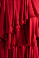 Beautiful red cloth close up. Ruffled layers.