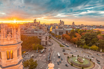 From the Cybele Palace the skyline of Madrid, Spain. View of the sunset in the Spanish capital city more tourist and visited of Europe with new and old buildings - obrazy, fototapety, plakaty