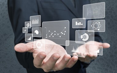 Man holding business elements icons on screen