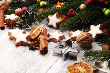 Baking christmas cookies. Typical cinnamon stars bakery for xmas with ingredients.
