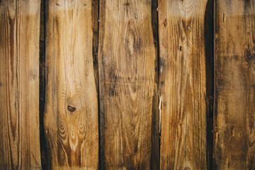 Naklejka premium Background of brown old natural wood planks Dark aged empty rural room with tree floor pattern texture Closeup gold view surface of retro pine logs inside vintage light warm interior with shadows