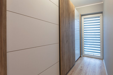 Interior of a modern house with wooden wardrobe