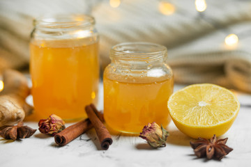Homemade ginger and lemon jam on a light background, close-up. Natural products to support the immune system in the winter. Phytotherapy. Healthy food, health status report