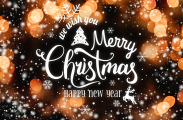 Christmas and New Year Typographical on dark bokeh background with snow and light. Xmas and Happy New Year theme. Flat lay, top view