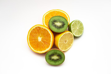 Creative layout made of fruits. Flat lay. lemon, orange, lime, kiwi, on the white background.