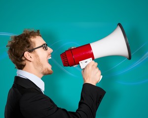 Male Professor Shouting Though Megaphone Against Chalkboard