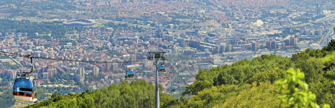 Panoramic view of Skopje and gondola cabin lift from Vodno mountain