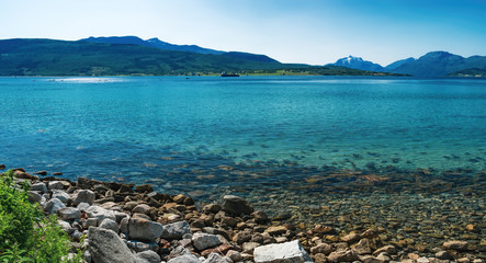 Fototapeta na wymiar Norwegian sea bay in summer scenery. View of Tjeldsundet strait from Hinnoya island in Northern Norway.