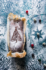 Chocolate banana bread decorated with   a christmas tree on top , various christmas decoration...