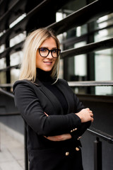 Smiling Female Business Leader With Arms Crossed