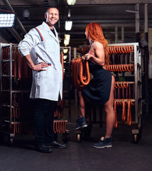 Butcher and his sexy girl assistant in the storage room.