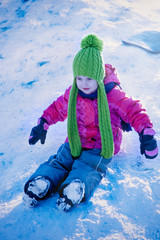 Fototapeta na wymiar Portrait of young beautiful child girl in deep snow. (holidays, new year, christmas, celebration concept)