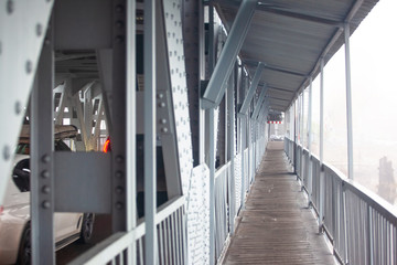 perspective walkway on a metal bridge