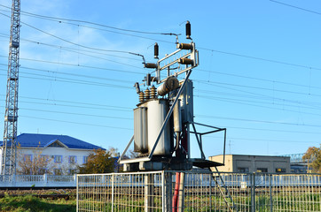 Electric transformer. Energy industry. Silhouette of electricity post