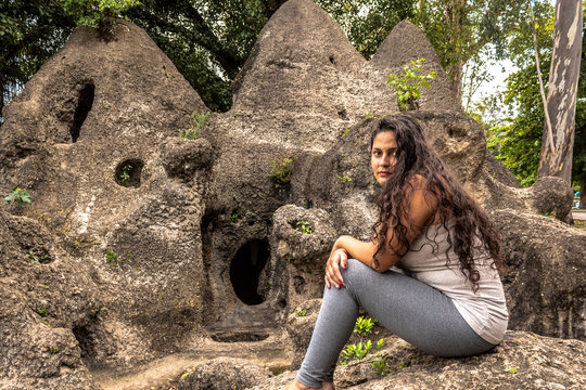 woman sitting on stones