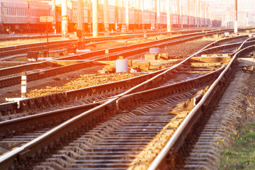 The concept of the railway with a gleam of sunlight, the area is covered with railway tracks, rest...