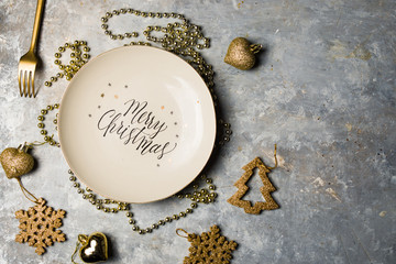 Christmas luxury holiday concept, with a plate with text impressed 