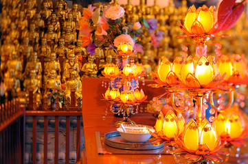 Golden statues of 500 Longhans and offerings in Longhua Buddhist temple.