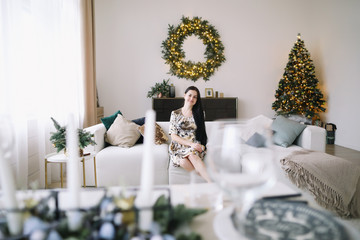 Girl in a festive interior with new year decorations. Christmas and  New Year concept