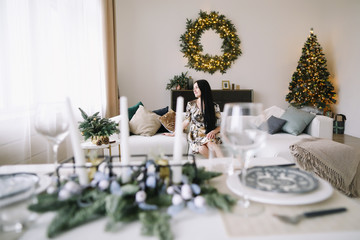 Girl in a festive interior with new year decorations. Christmas and  New Year concept