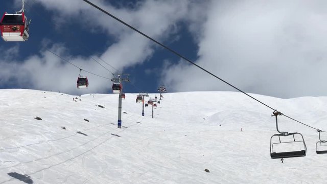 sunny day winter time gudauri ski resort lift ride slow motion up view 4k georgia
