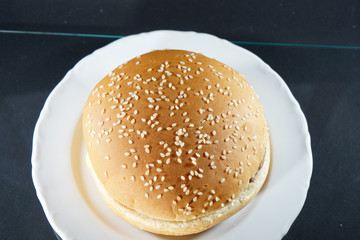 Delicious hamburger with cheese and ketchup prepared in the kitchen and photographed in the studio 