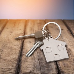 House keys with house figure  on background