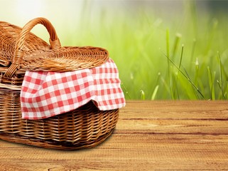 Picnic Basket with napkin om nature background