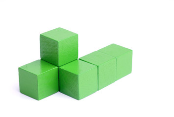 Green wooden blocks isolated on white background.
