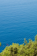 Fototapeta na wymiar Group of red kayaks off the Ligurian coast