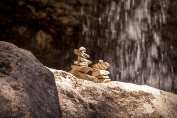 Two Cairns by a Water Fall