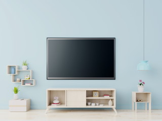 TV on the cabinet in modern living room on blue wall background,3D rendering