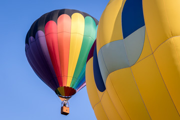 Two Hot Air Balloons Against a Blue Sky