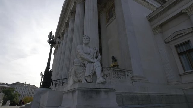 Statue at the Austrian Parliament Building in Vienna, Austria, featuring magnificent neoclassical architecture and one of the city's most iconic government landmarks