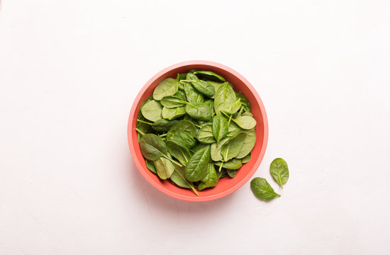 Washed fresh mini spinach in a bowl on the table