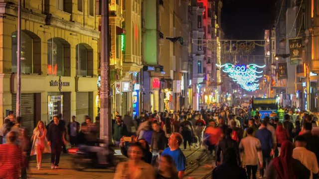 Taksim, Istanbul / Turkey - November 19 2017: The popular travel destination of Istanbul Taksim Istiklal Street at night. Time lapse video