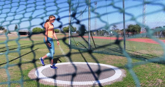 Female athlete getting ready for discus throw 4k