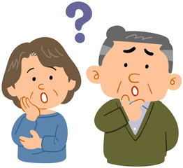疑問を感じるシニアの夫婦　上半身　心配　困った　不安
