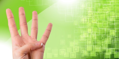 Young woman showing four fingers with hand on blue background