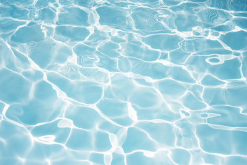 Texture of water in swimming pool for background