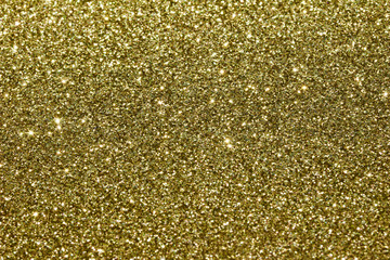 Sparkling macro gold glitter bokeh abstract background